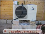 instalar aire acondicionado split - unidad exterior de aire acondicionado split sobre bloques de hormigon