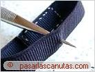 foto perforando la pulsera